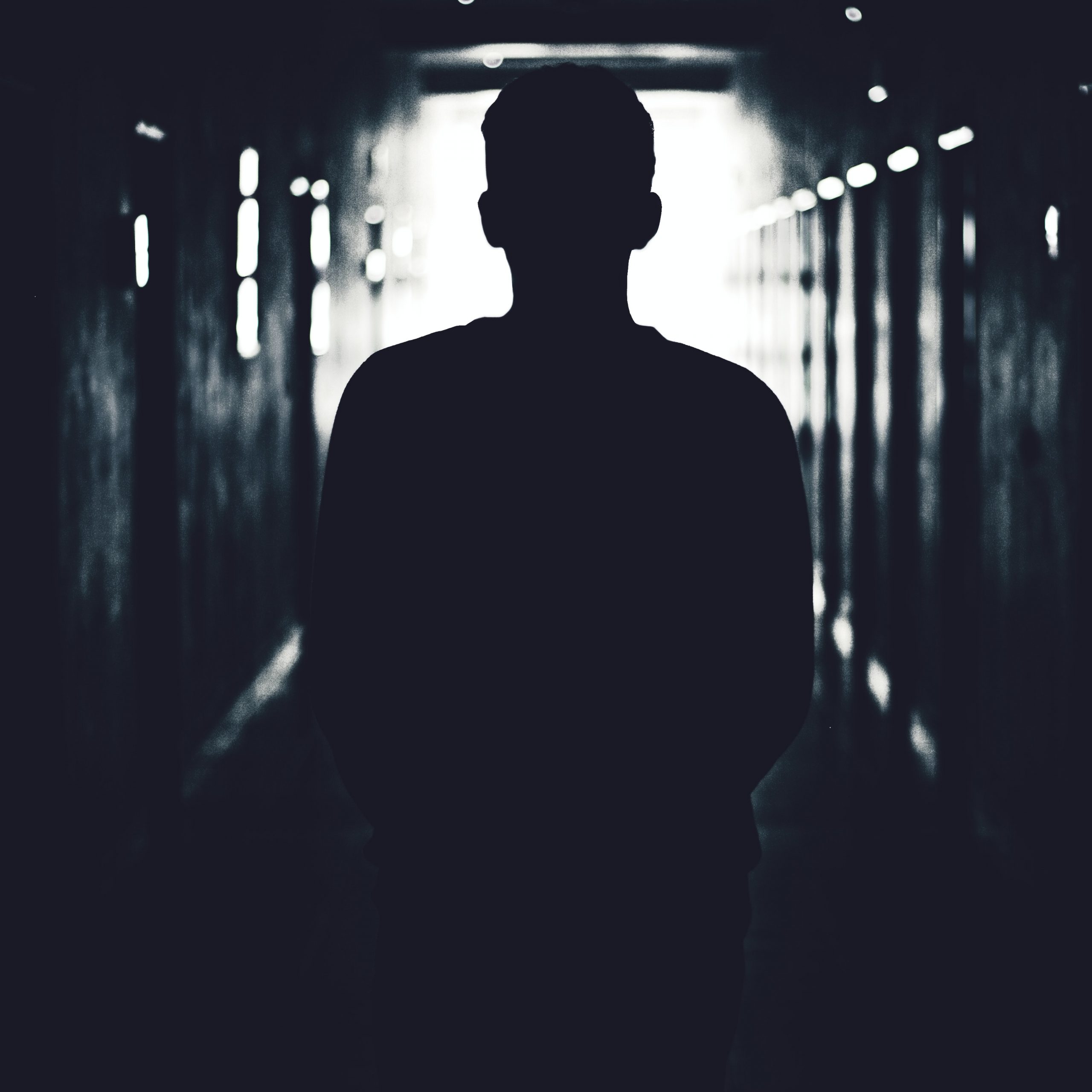 Man in dark tunnel